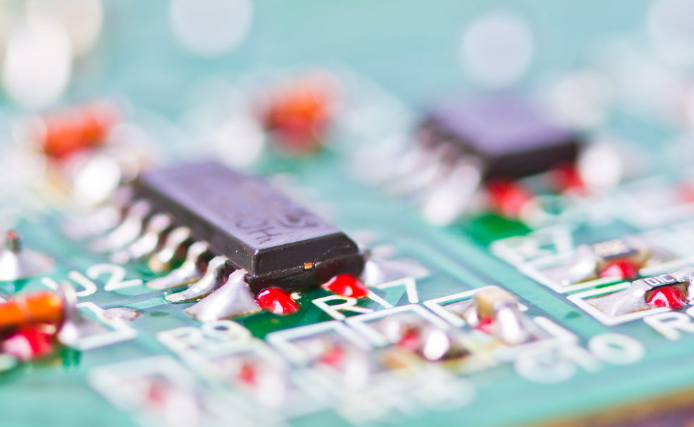 Detail of an electronic printed circuit board with many electric